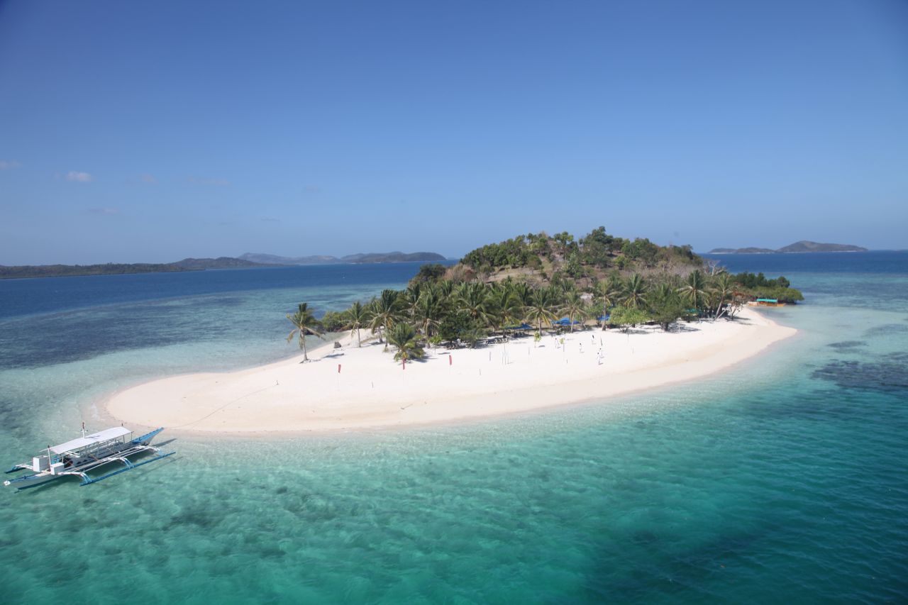 Palawan's beaches, like this one on Pass Island, are usually deserted or, at most, sparsely populated.