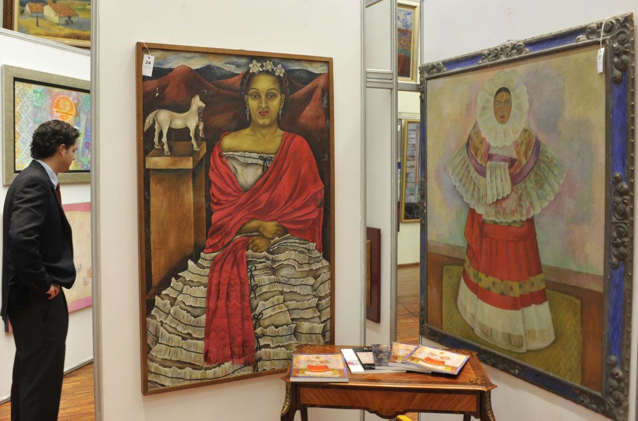 Painter <a href="http://clara.nmwa.org/index.php?g=entity_detail_print&entity_id=3933" target="_blank" target="_blank">Maria Izquierdo</a> (1902-55), whose self-portrait is shown on the left, was inspired by Mexican folklore. Among her admirers was fellow Mexican artist Diego Rivera, whose work is shown on the right. Her 1930 solo show in New York was the first one-person exhibition in the United States to feature the work of a Mexican woman. Born in 1902, Izquierdo grew up in a rural village before moving to Mexico City in 1923. Several years later, she became a student at the city's Escuela Nacional de Bellas Artes, which is geo-tagged in the Google app.