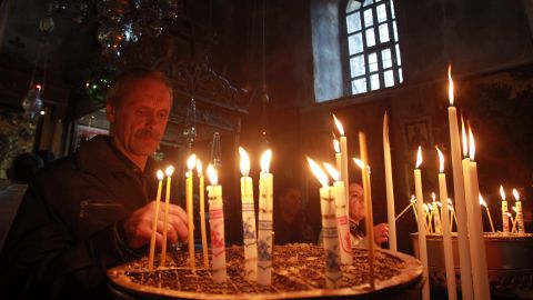 Christians light candles last month in the Church of the Nativity in the West Bank town of Bethlehem, the birthplace of Jesus.