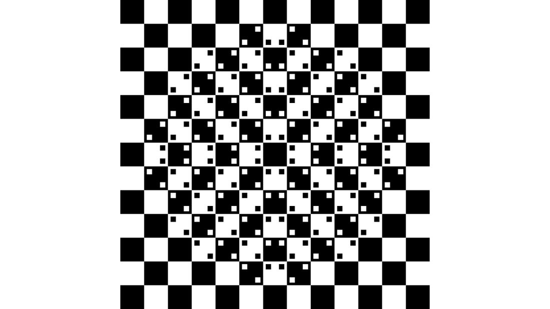 The center of this image, made only with squares, appears to bulge out, even though all of the lines are actually straight. 