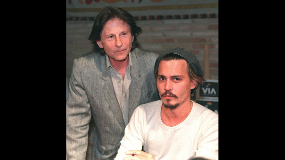 Polanski stands behind actor Johnny Depp during a press conference in Toledo, Spain, in 1998. The pair were shooting the film "The Ninth Gate" in Toledo. 