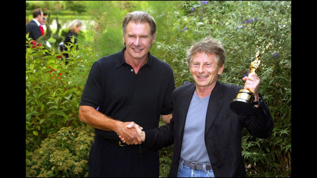 Polanski receives his 2003 Academy Award for best director for "The Pianist" from Harrison Ford in France.