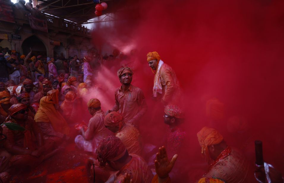 FEBRUARY 27 -- BARSANA, INDIA: Hindu men from the village of Nandgaon throw colored powder at each other as part of the region's Lathmar Holi festivities. During Lathmar Holi, men from Nandgaon -- said to be the home of the Hindu god Krishna -- tease women from neighboring Barsana -- the home of Krishna's consort, Radha. In response, Barsana's women "beat" the men with wooden sticks.