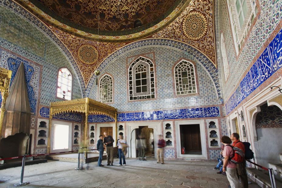 Inside Topkapi Palace, the Privy Chamber of Murat III, pictured, has an indoor pool, gilded fireplace and walls decorated with blue, white and coral Iznik tiles from the 16th century.
