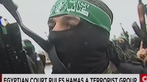 A man wears the headband for al Qassam brigades, the military wing of Hamas.