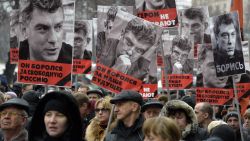 Russia's opposition supporters carry portraits of Kremlin critic Boris Nemtsov during a march in central Moscow on March 1, 2015. The 55-year-old former first deputy prime minister under Boris Yeltsin was shot in the back several times just before midnight on February 27 as he walked across a bridge a stone's throw from the Kremlin walls.