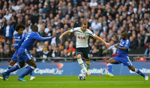 Tottenham's star young striker Harry Kane is surrounded by Chelsea defenders in the final at Wembley.