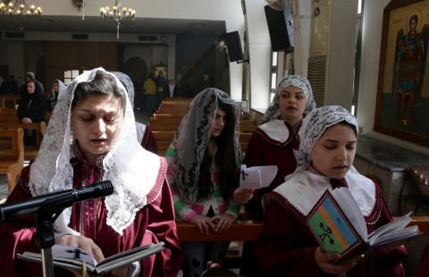 Displaced Assyrian women who fled their homes due to ISIS attacks pray at a church on the outskirts of Damascus, Syria, on Sunday, March 1. ISIS militants abducted at least 220 Assyrians in Syria. 
