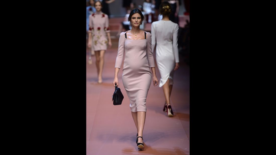 Italian model Bianca Balti walks the Dolce & Gabbana runway while pregnant with her second child.