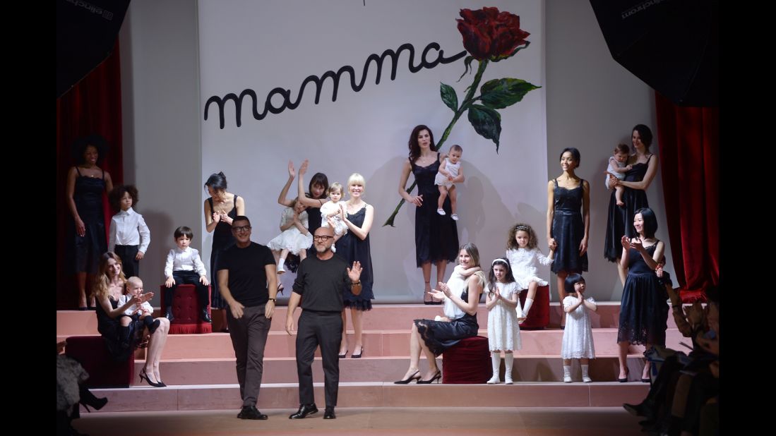 Stefano Gabbana and Domenico Dolce come out to applause at the end of their show during Milan Fashion Week.
