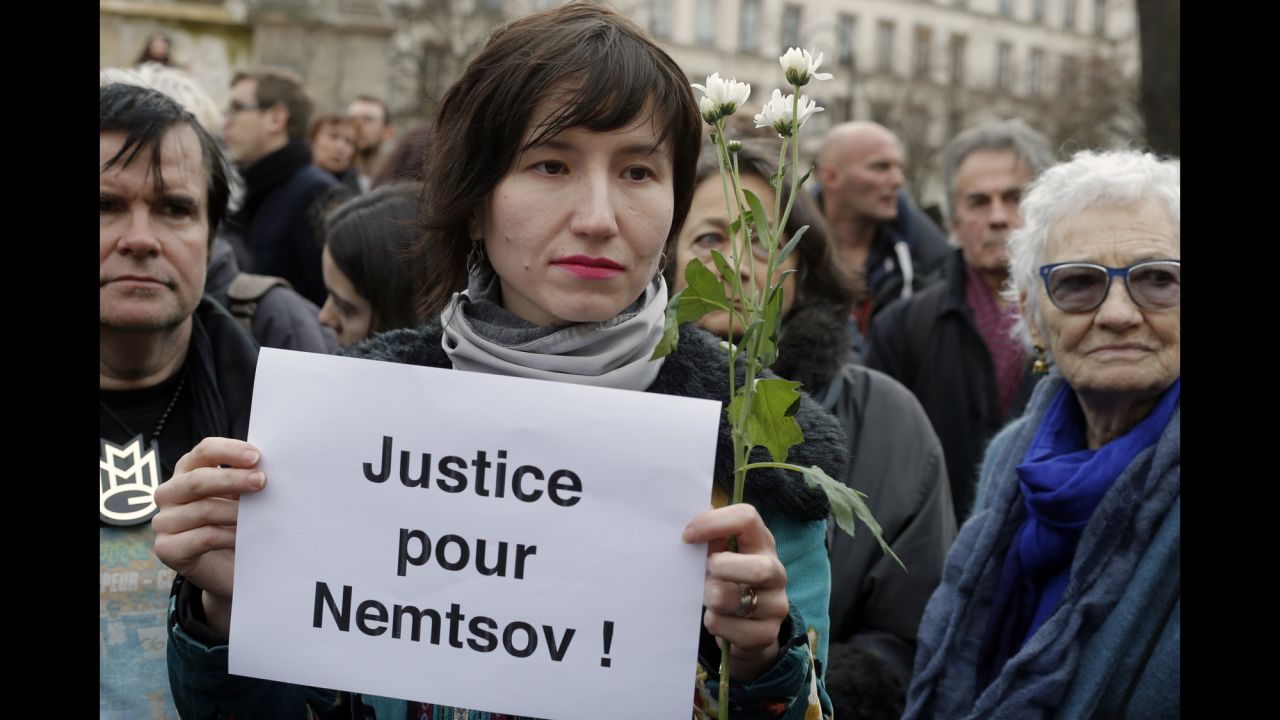 People gather at Innocent Plaza in Paris on March 1 to remember Nemtsov.
