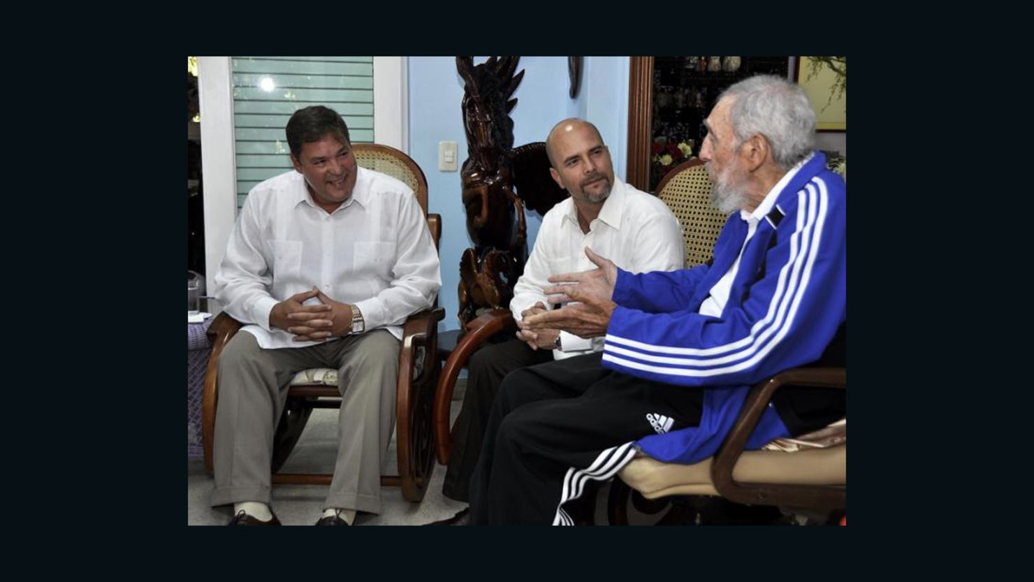 Fidel Castro, right, meets with two of the five Cuban intelligence agents formerly jailed in the United States. 