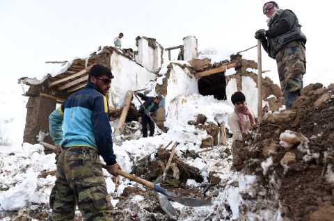 Afghan survivors of an avalanche search their destroyed houses in a village of in Panjshir province, north of Kabul on March 1. Scores of people have died in a series of avalanches in mountainous northeastern Afghanistan after heavy snowstorms.
