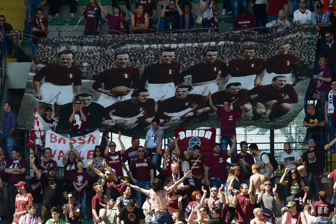 Supporters of Torino FC hold a banner commemorating the players who lost their lives when their plane crashed in the Superga air disaster, on the 65th anniversary of the tragedy last May.