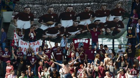 Supporters of Torino FC hold a banner commemorating the players who lost their lives when their plane crashed in the Superga air disaster, on the 65th anniversary of the tragedy last May.