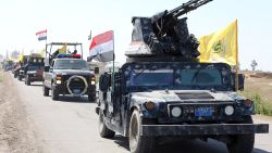 Members of the Iraqi security forces heading from the city of Samarra north of Baghdad drive towards al-Dawr area south of Tikrit to launch an assault against the Islamic State group (IS) on February 28, 2015.