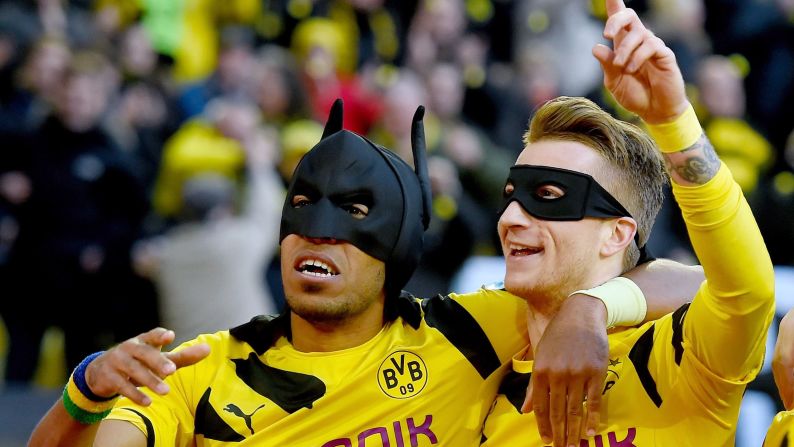 Borussia Dortmund teammates Pierre-Emerick Aubameyang, left, and Marco Reus celebrate a goal with Batman and Robin masks on Saturday, February 28, during a Bundesliga match against Schalke in Dortmund, Germany. Dortmund won the Ruhr derby 3-0 with goals from Aubameyang, Reus and Henrikh Mkhitaryan.