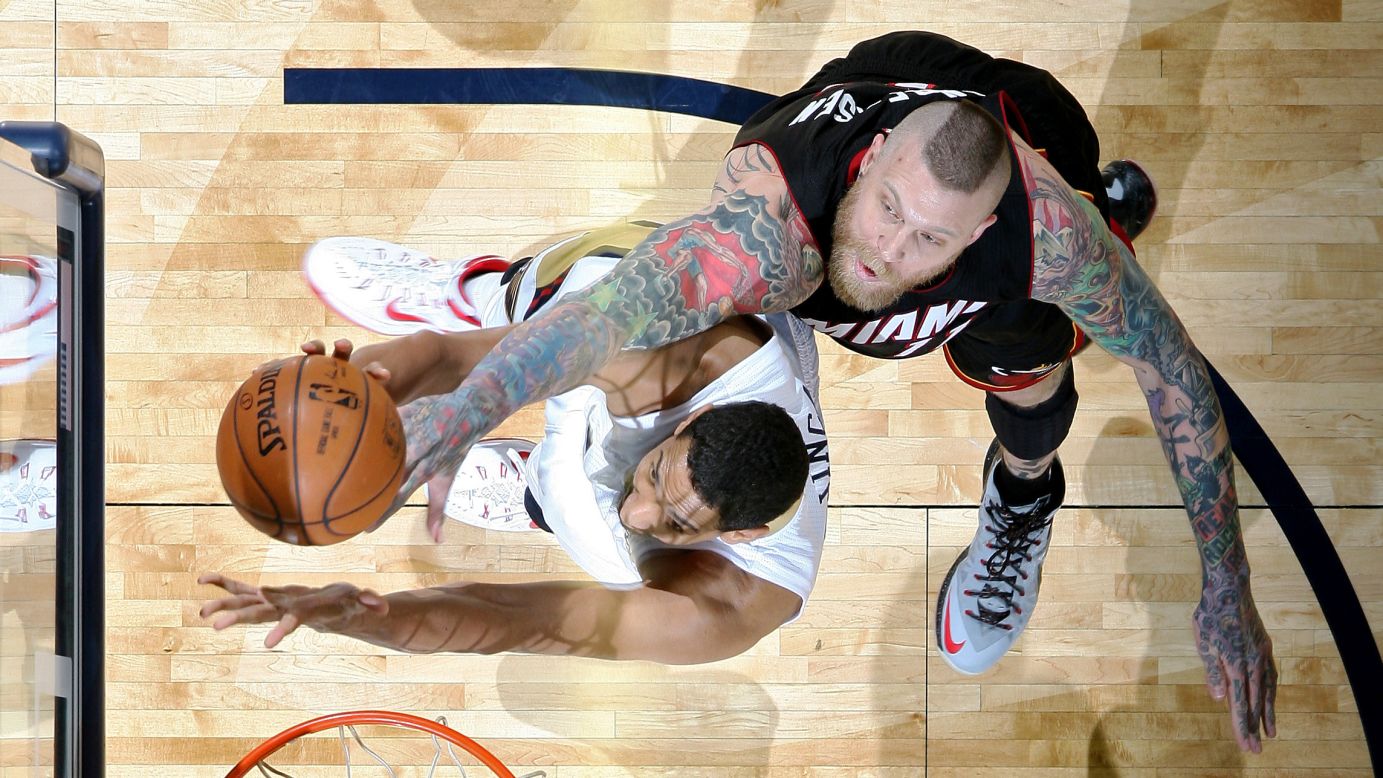 Miami's Chris Andersen, right, goes up to block the shot of Alexis Ajinca during an NBA game in New Orleans on Friday, February 27. Ajinca had a career-high 24 points as the New Orleans Pelicans won 104-102.