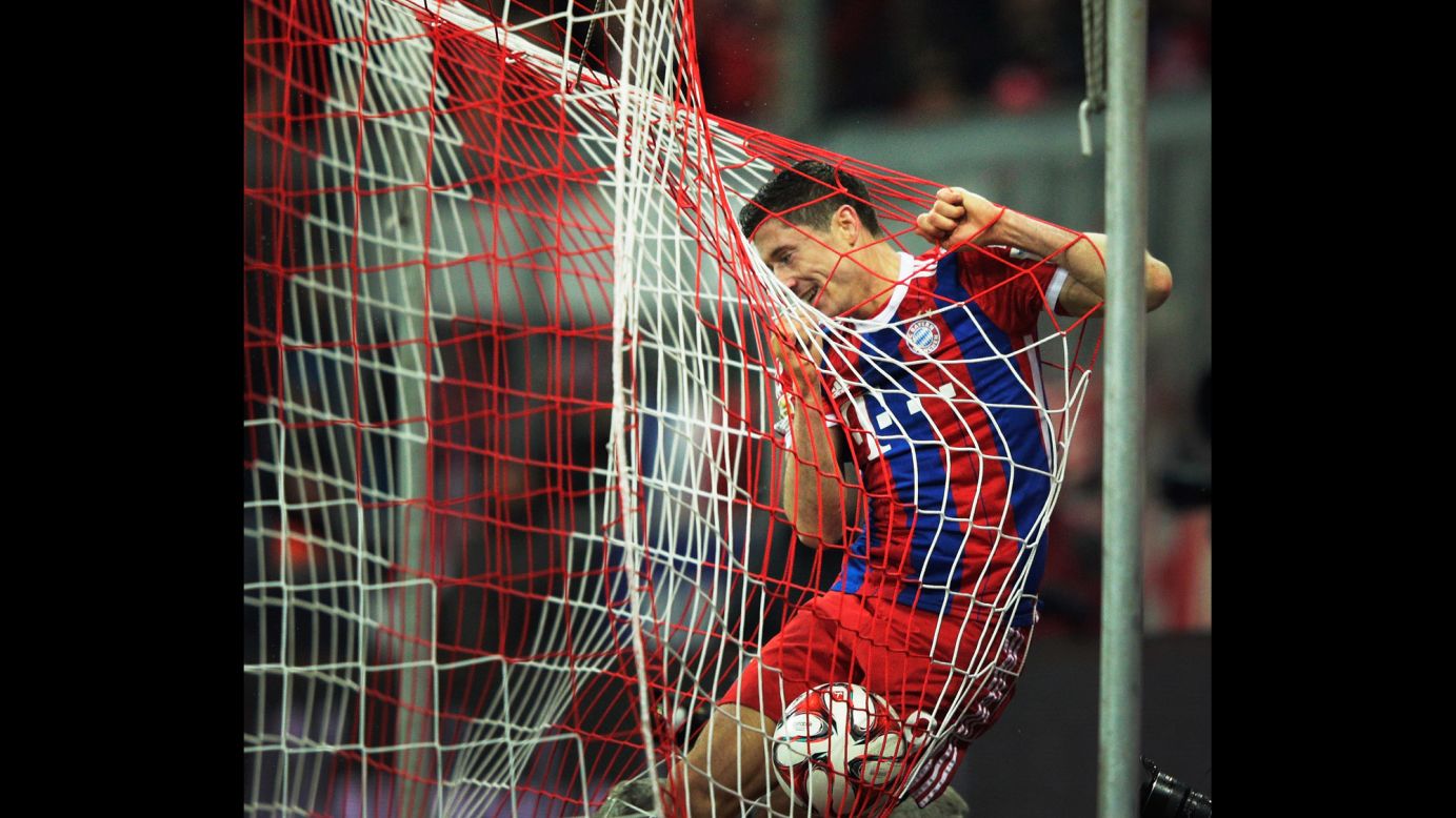 Bayern Munich striker Robert Lewandowski celebrates after scoring a goal against Cologne during a Bundesliga match played Friday, February 27, in Munich, Germany. Bayern won 4-1 to stretch its commanding lead at the top of the German league.