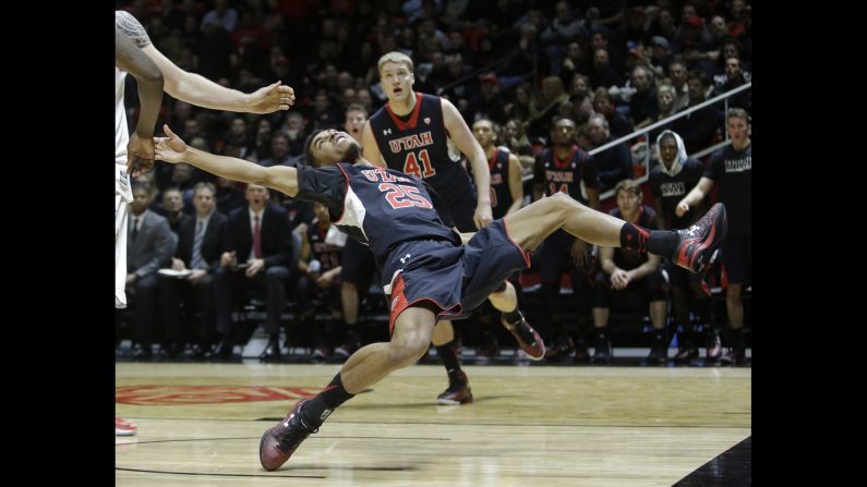 Utah guard Kenneth Ogbe falls after being fouled by Arizona State forward Eric Jacobsen during a college basketball game played Thursday, February 26, in Salt Lake City. Utah led 41-9 at halftime and won 83-41.