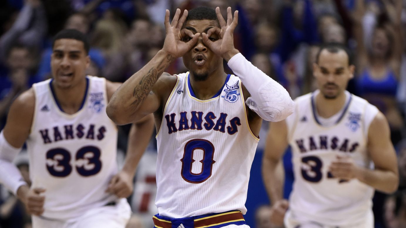 Kansas point guard Frank Mason III puts on his "3-point goggles" after hitting a shot against Texas during a game Saturday, February 28, in Lawrence, Kansas. Mason's Jayhawks won 69-64.
