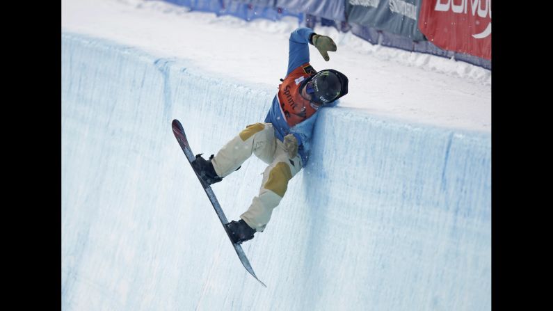Swiss snowboarder Christian Haller crashes into the halfpipe wall Sunday, March 1, during a World Cup event in Park City, Utah.