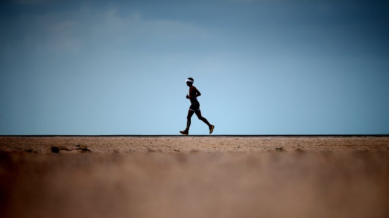 An athlete runs during Challenge Dubai, a triathlon held in Dubai, United Arab Emirates, on Friday, February 27.