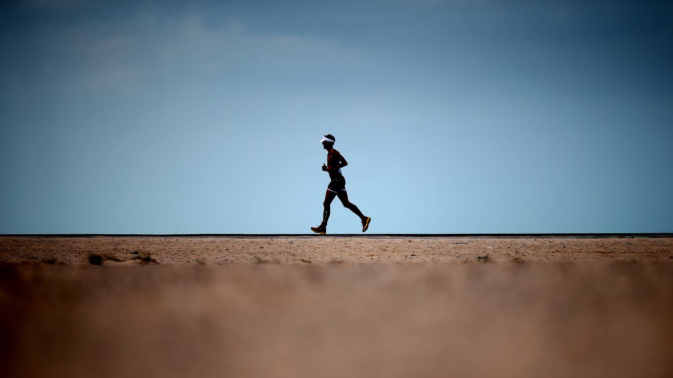 An athlete runs during Challenge Dubai, a triathlon held in Dubai, United Arab Emirates, on Friday, February 27.