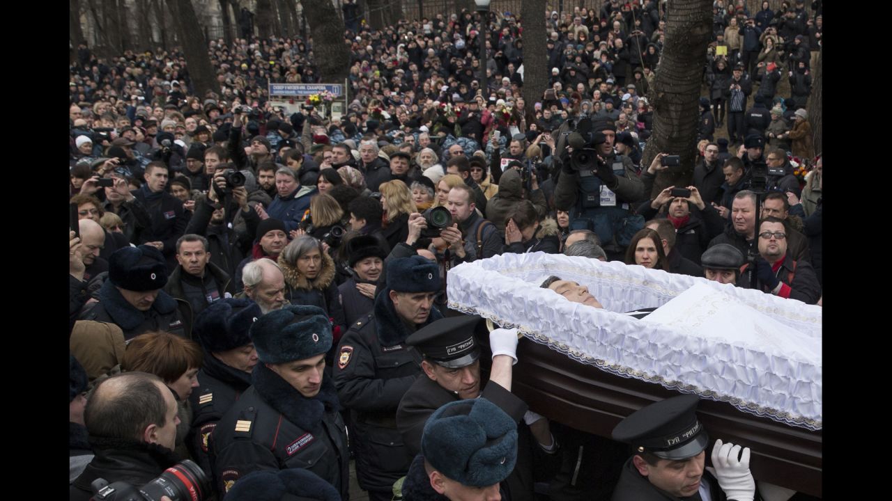 People follow the coffin of Russian opposition leader Boris Nemtsov during a farewell ceremony in Moscow on Tuesday, March 3. Nemtsov, a vocal opponent of Russian President Vladimir Putin's, was gunned down hundreds of feet away from the Kremlin on Friday, February 27. The assassination has spawned a flood of conspiracy theories; many suspect the Kremlin of either direct or indirect involvement. Putin condemned the killing and ordered three law enforcement agencies to investigate, the Kremlin said.
