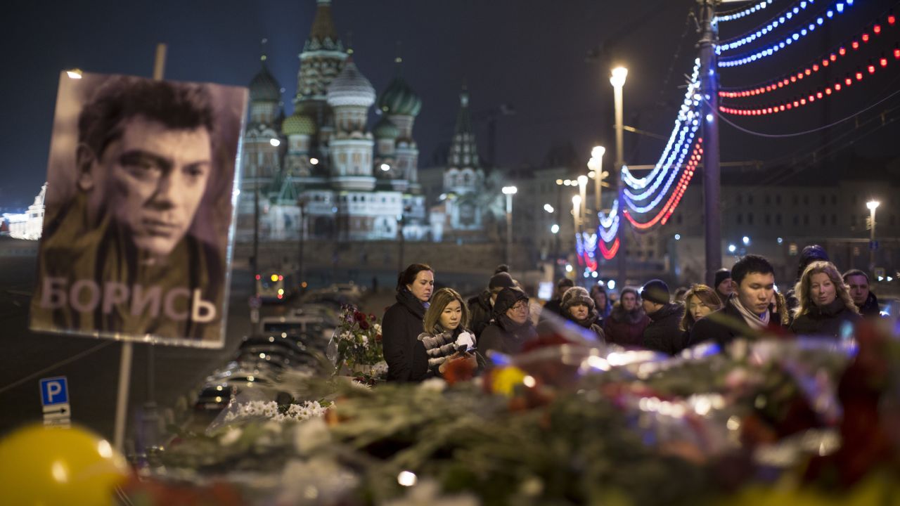 People pay tribute to Nemtsov on Monday, March 2, at the scene of the opposition leader's shooting in Moscow.
