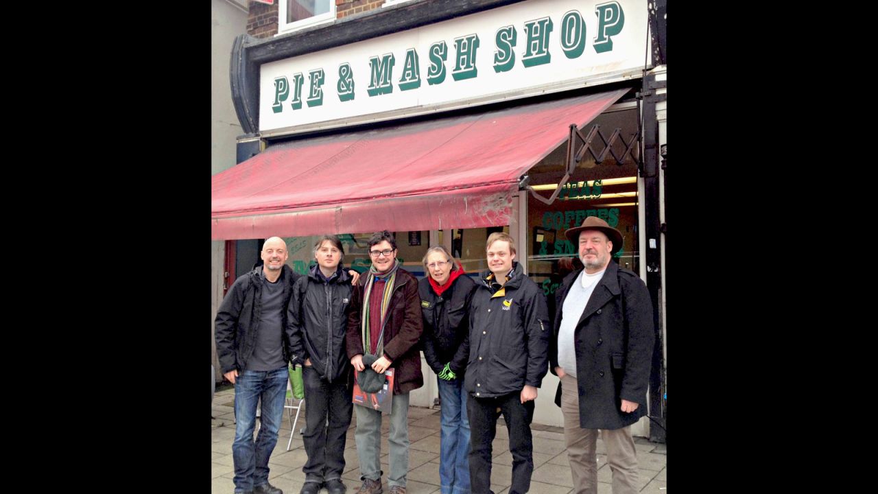 Members of the Pie and Mash Club, with Nick Evans (far left), outside the Pie and Mash Shop in Welling.