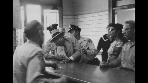 The Rev. Martin Luther King Jr. is arrested for loitering outside a courtroom where his friend Ralph Abernathy was appearing for a trial in 1958.