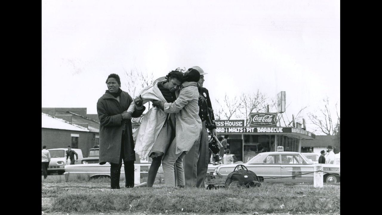 Activist Amelia Boynton is helped to her feet after being knocked unconscious by a state trooper. "The quality, the depth, the sense of reality that (photographer Charlie Moore) brings to the work is unparalleled," said Steven Kasher, <a href="http://www.stevenkasher.com/" target="_blank" target="_blank">whose gallery is showing the Selma images</a> of Moore and other essential witnesses of the civil rights era.