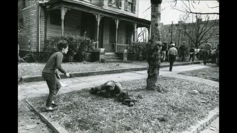 Pam Clemson rushes to the aid of a fellow demonstrator who was felled by a blow to the head in Selma.