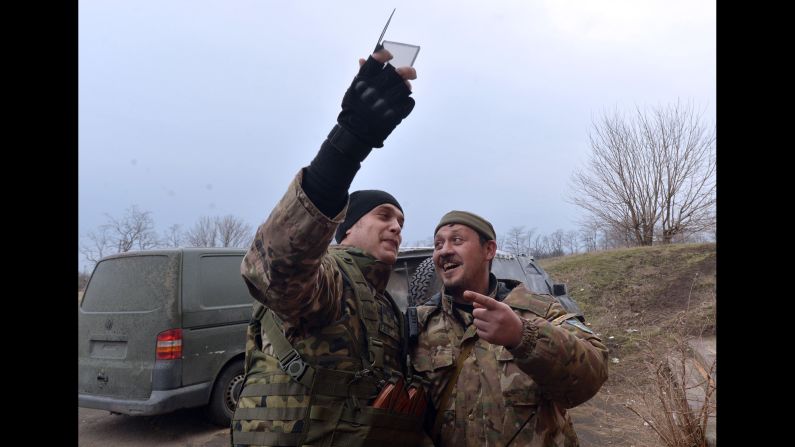 Ukrainian servicemen take a photo together Thursday, February 26, in Chermalyk, Ukraine.