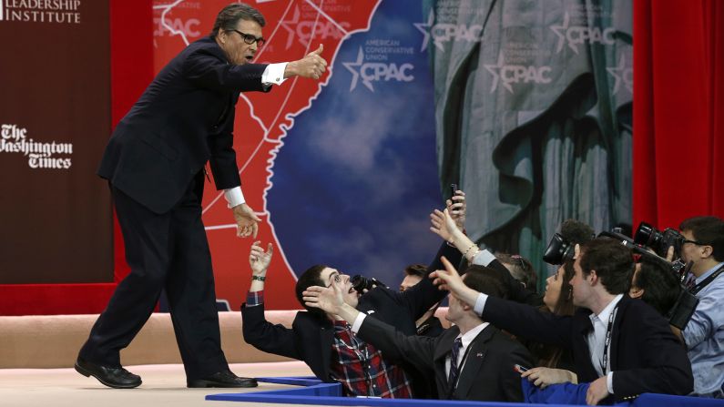 A supporter of former Texas Gov. Rick Perry snaps a photo of Perry, who had just spoken Friday, February 27, at the Conservative Political Action Conference in Maryland.