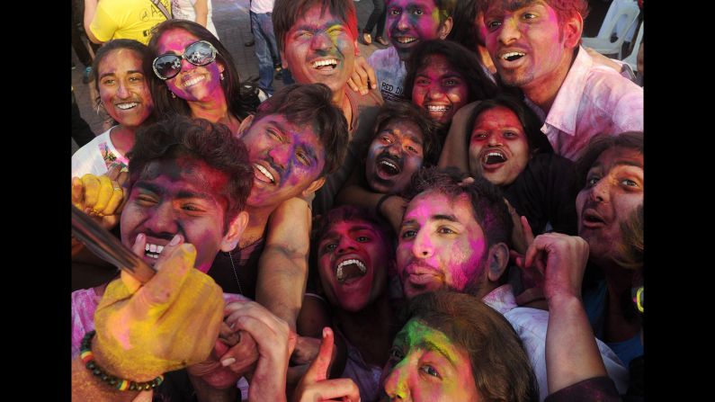 People in Manila, Philippines, take a selfie while wearing colored powder for the Indian festival of Holi on Sunday, March 1.