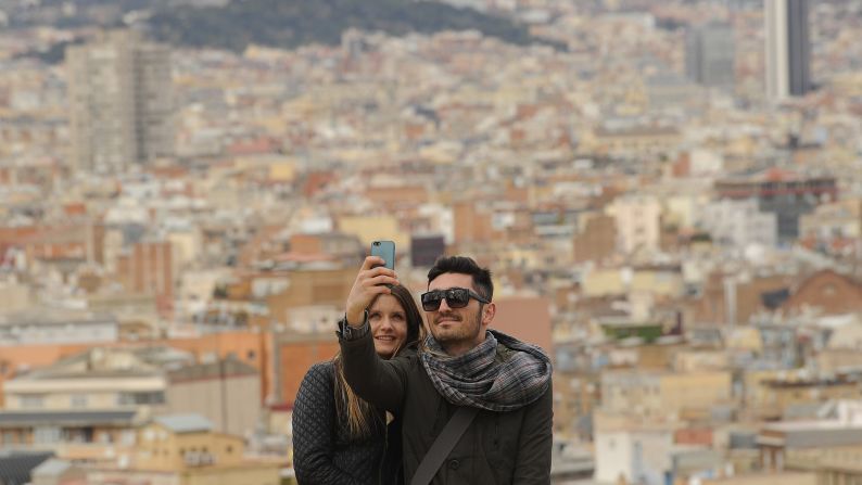 Barcelona, Spain, is the backdrop for this duo's selfie on Wednesday, February 25.