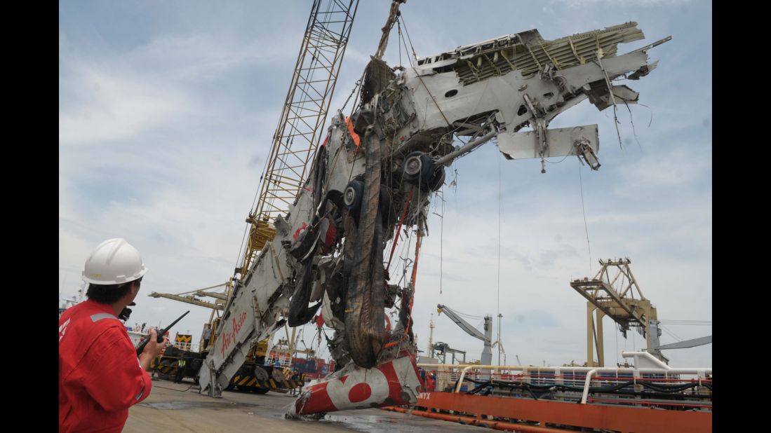 The fuselage is lifted from the Java Sea during the recovery mission on March 2.