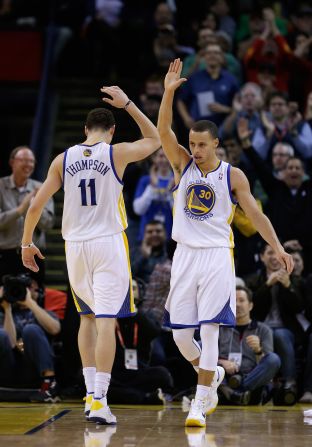 The Warriors backcourt tag-team of Stephen Curry (right) and Klay Thompson combined for more three-pointers (602) in the 2016 regular season than any other <em>team</em> in NBA history. 