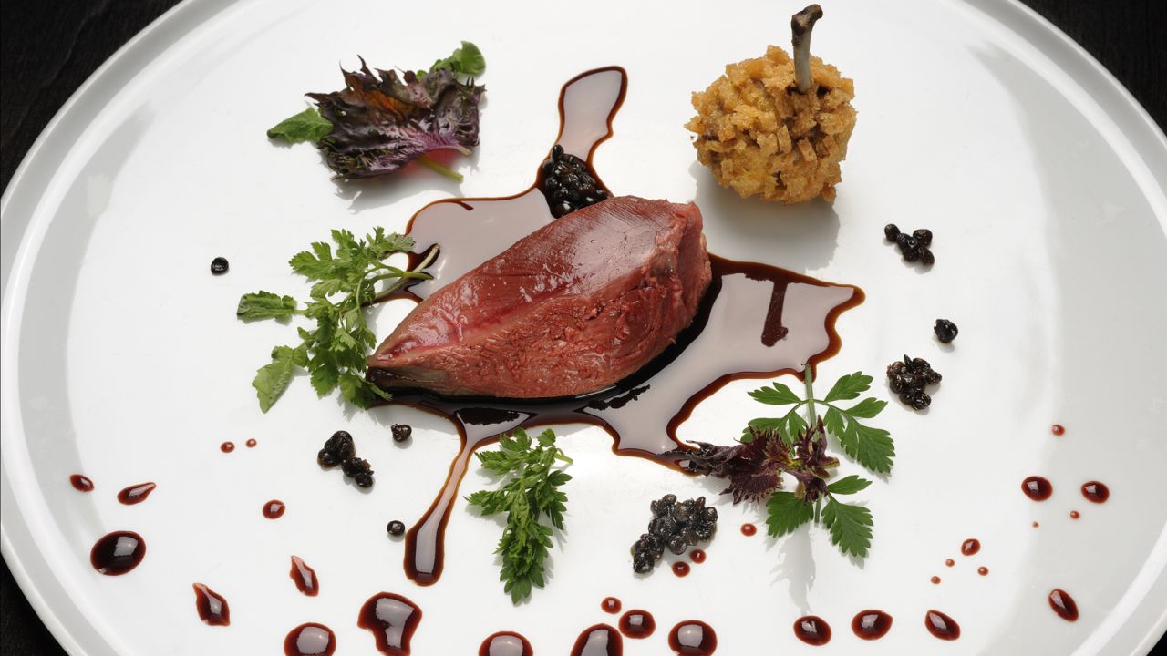 Osteria Francescana's "Hunting the Pigeon" dish features pigeon breast, beetroot juice, turnips, porcini mushrooms, apples and truffles.