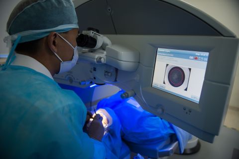 Unlike Lasik surgery, pictured above, the patient would be able to undergo the whole procedure seated in a chair. Critics say the procedure may carry the risk of glaucoma, but the company says the particles released by the process are too small to create eye health problems.