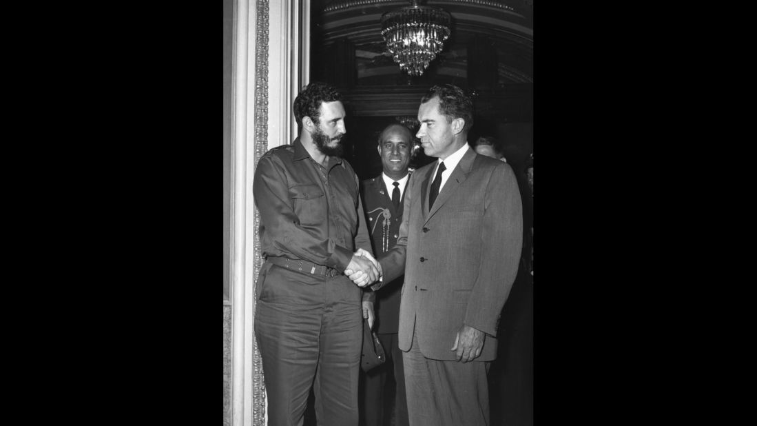 Castro shakes hands with US Vice President Richard Nixon during a reception in Washington in 1959.   