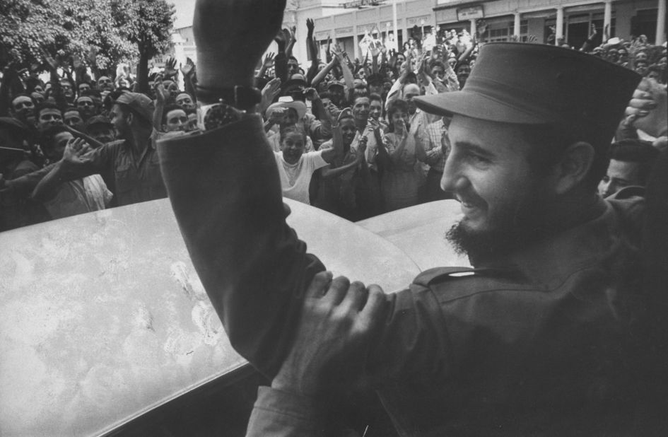 Crowds cheer Castro on his victorious march into Havana in 1959.