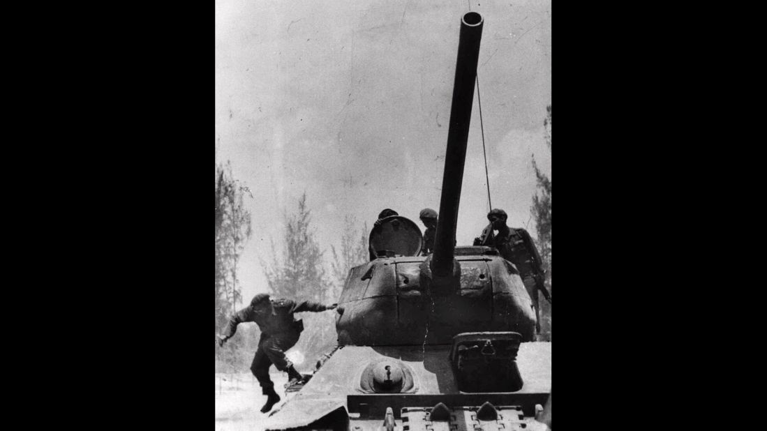 Castro jumps from a tank in April 1961 as he arrives at Giron, Cuba, near the Bay of Pigs. That month, a group of about 1,300 Cuban exiles, armed with US weapons, made an unsuccessful attempt to overthrow Castro.