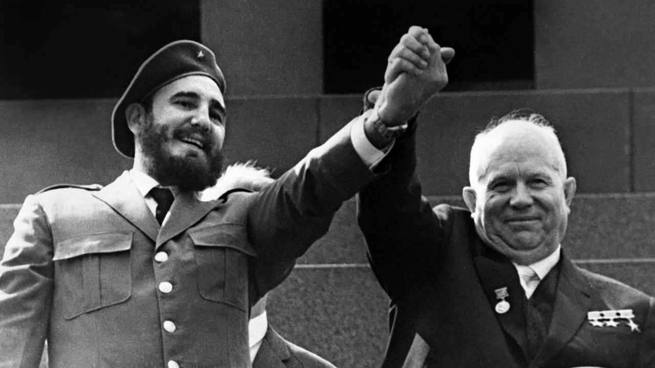 Castro raises arms with Soviet leader Nikita Khrushchev during a four-week visit to Moscow in May 1963.
