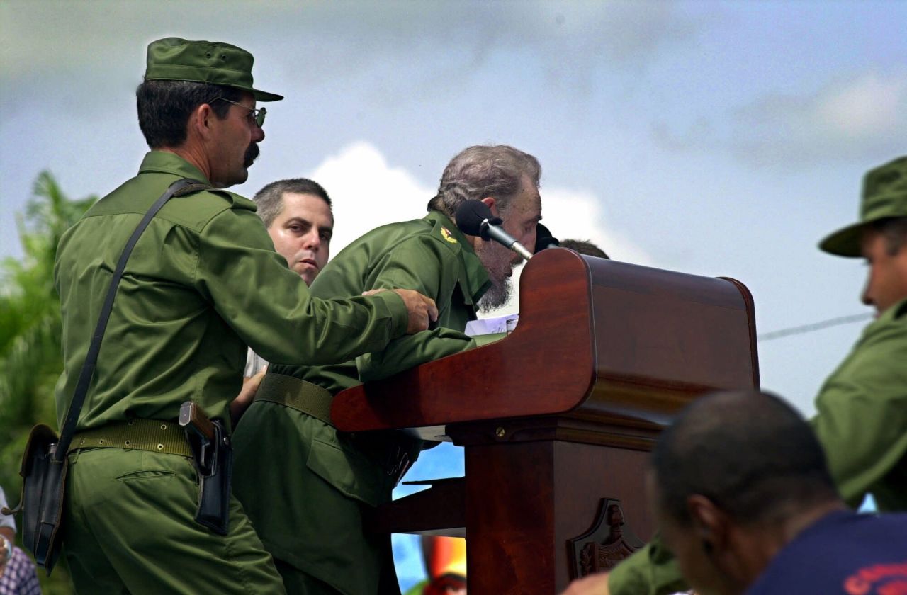 Castro is helped by aides after he appeared to faint while giving a speech in Cotorro, Cuba, in June 2001. He returned to the podium less than 10 minutes later to assure the audience he was fine and that he just needed to get some sleep.