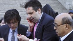 U.S. Ambassador to South Korea Mark Lippert, center, gets into a car to leave for a hospital in Seoul, South Korea, Thursday, March 5, 2015 after being attacked by a man. Lippert was slashed on the face and wrist by a man wielding a blade and screaming that the rival Koreas should be unified, South Korean police said Thursday. (AP Photo/Yonhap, Kim Ju-Sung) KOREA OUT