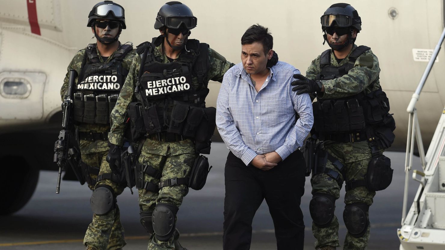 The alleged leader of the Zetas drug cartel, Omar Trevino Morales, aka 'Z-42' is taken under custody at the Attorney General Office's hangar at the airport in Mexico City.