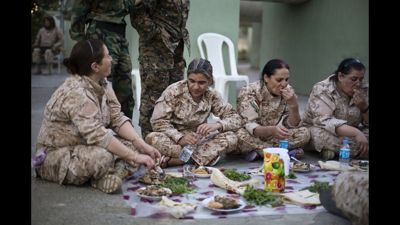 Women gather to eat yaprax, a traditional Kurdish dish.